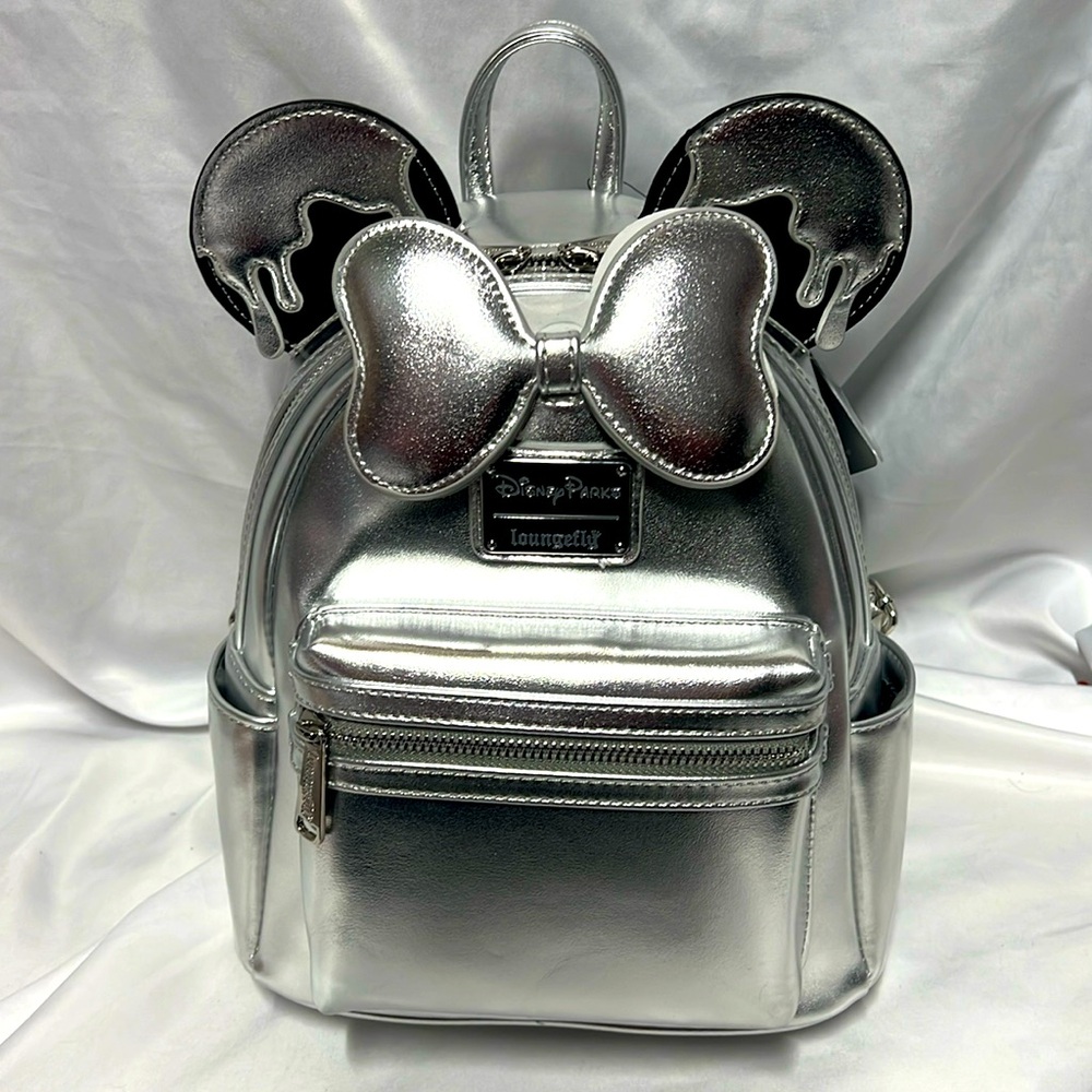 NWT. Disney Loungefly Backpack -  Disney100
gorgeous shiny silver tone